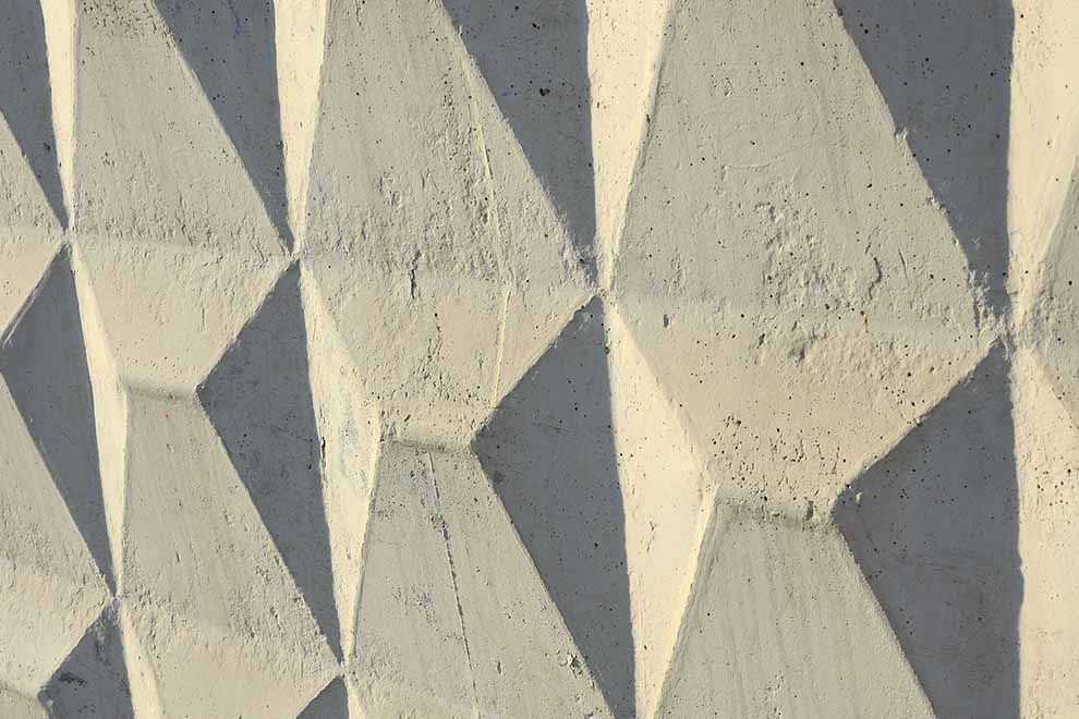 parede de concreto de um edifício ou casa texturizado com relevos